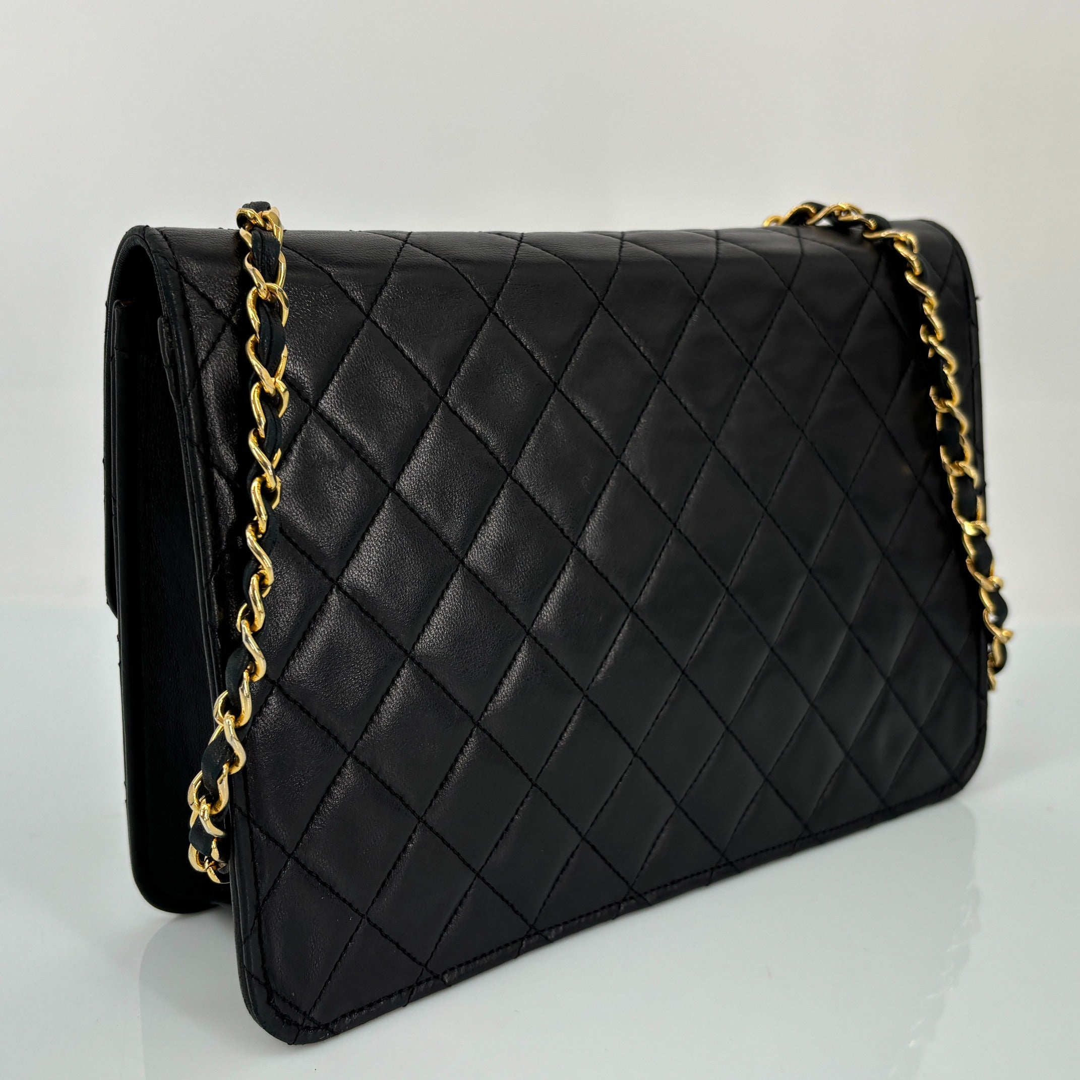Chanel Single Flap Bag Push-Lock Black Matelassé Leather incl. Dustbag