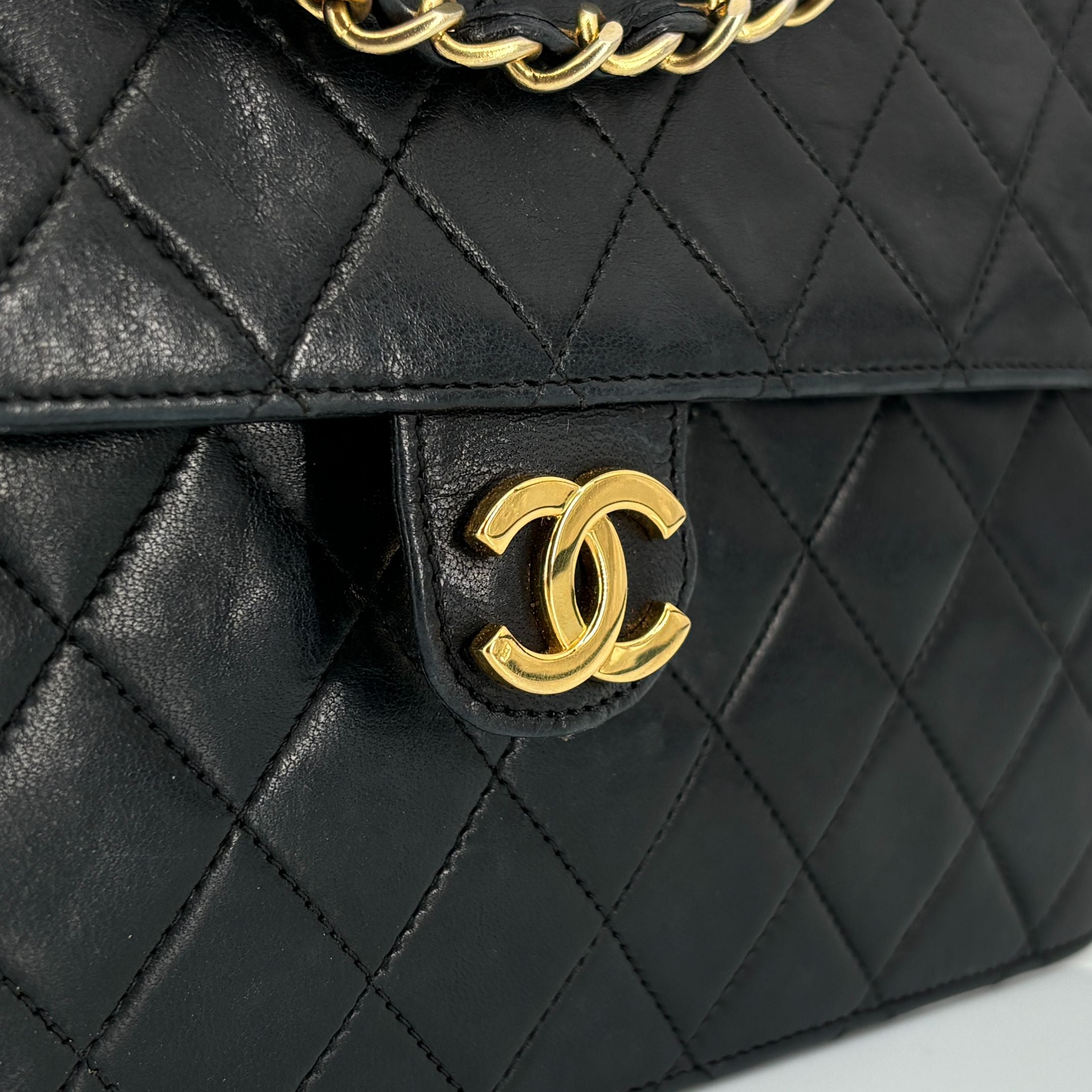 Chanel Single Flap Bag Push-Lock Black Matelassé Leather