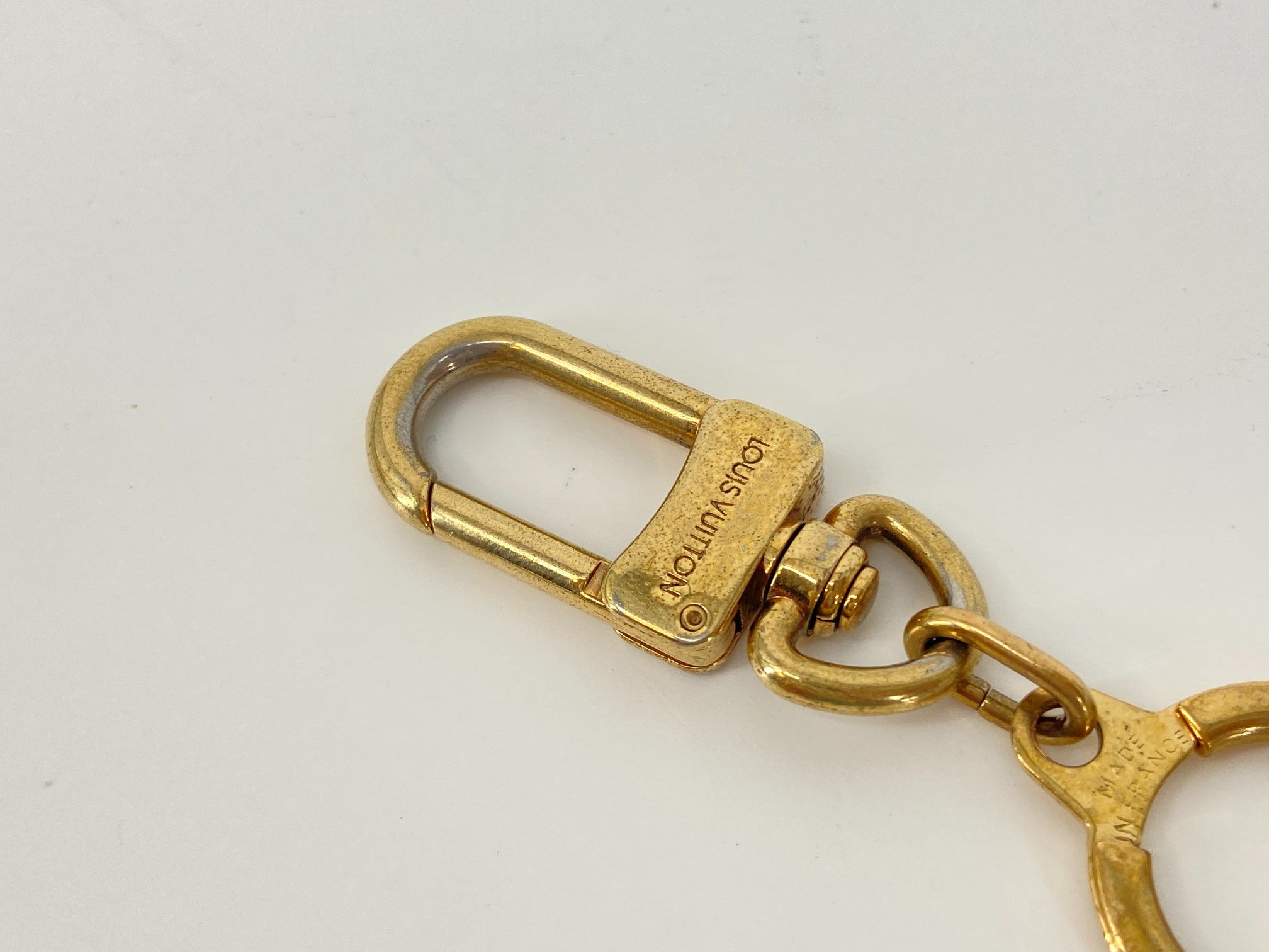 Louis Vuitton Porte Cles Bolt Gold Tone