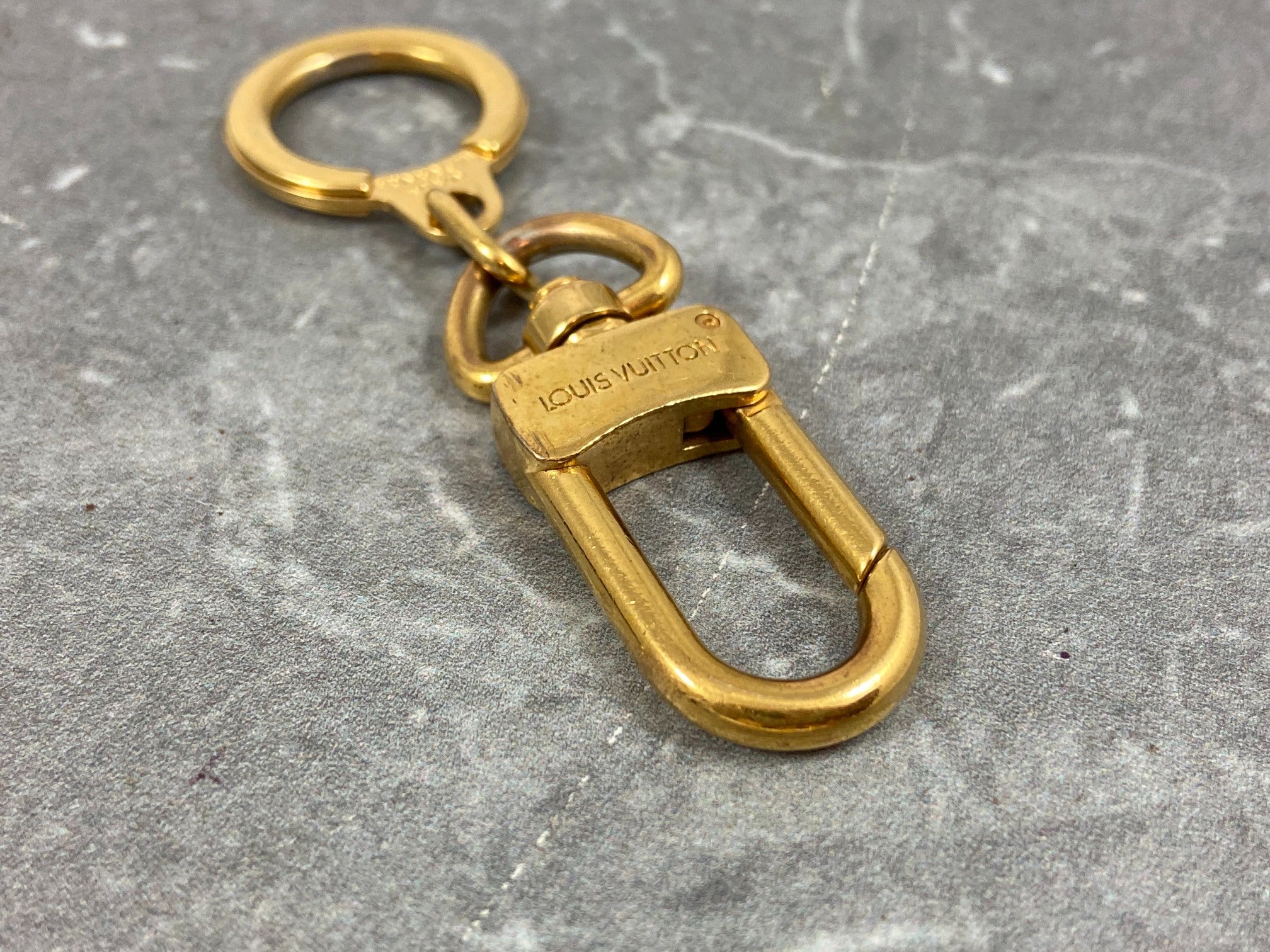 Louis Vuitton Porte Cles Bolt Gold Tone