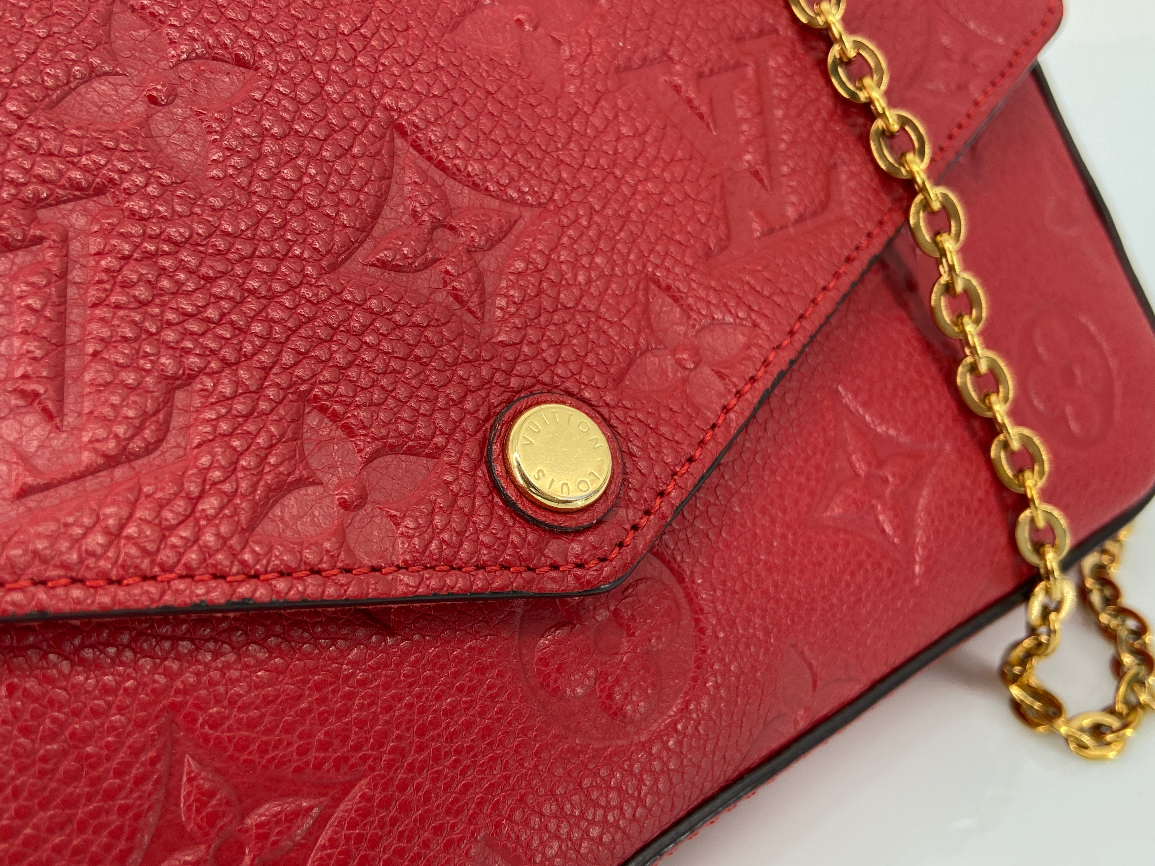 Louis Vuitton Félicie Pochette Red Empreinte Leather incl. Dustbag