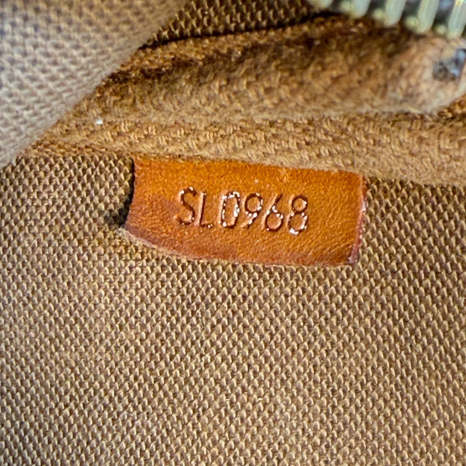 Louis Vuitton Pochette Accessoires Braun Monogram Canvas