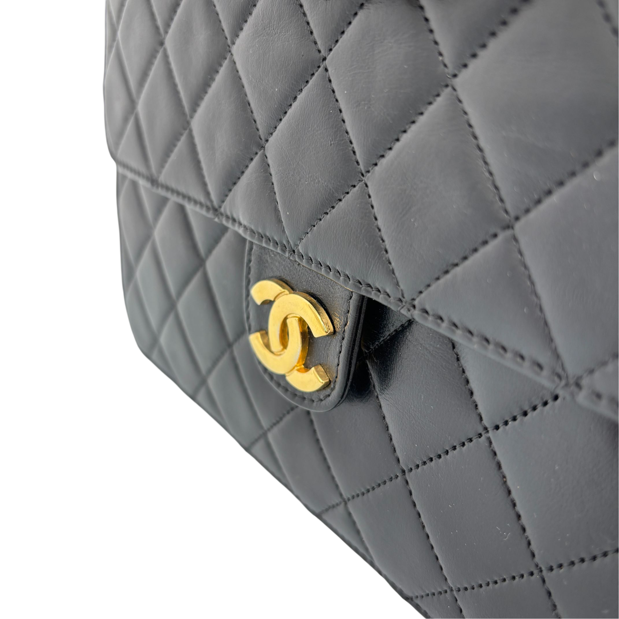 Chanel Single Flap Bag Push-Lock Black Matelassé Leather