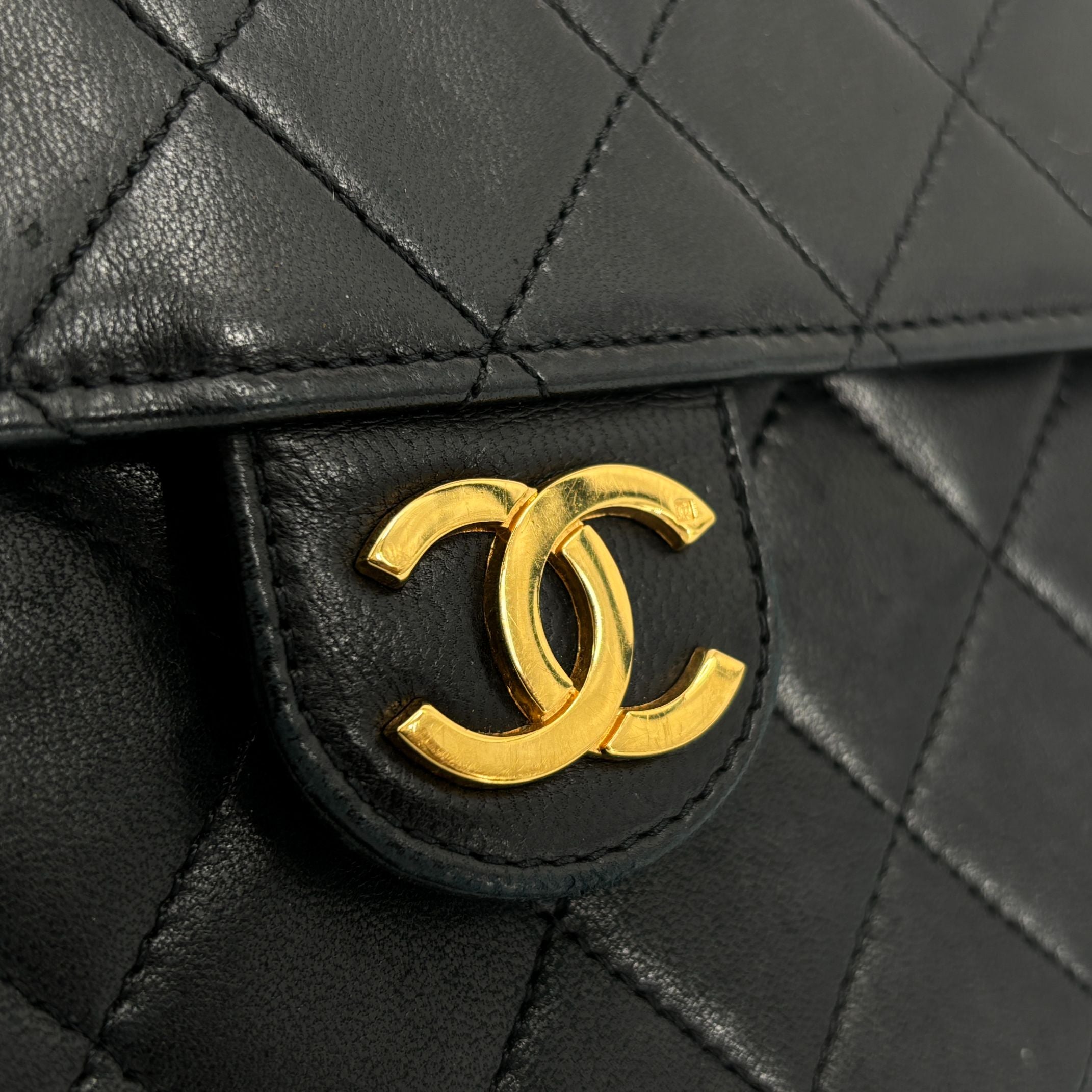 Chanel Single Flap Bag Push-Lock Black Matelassé Leather