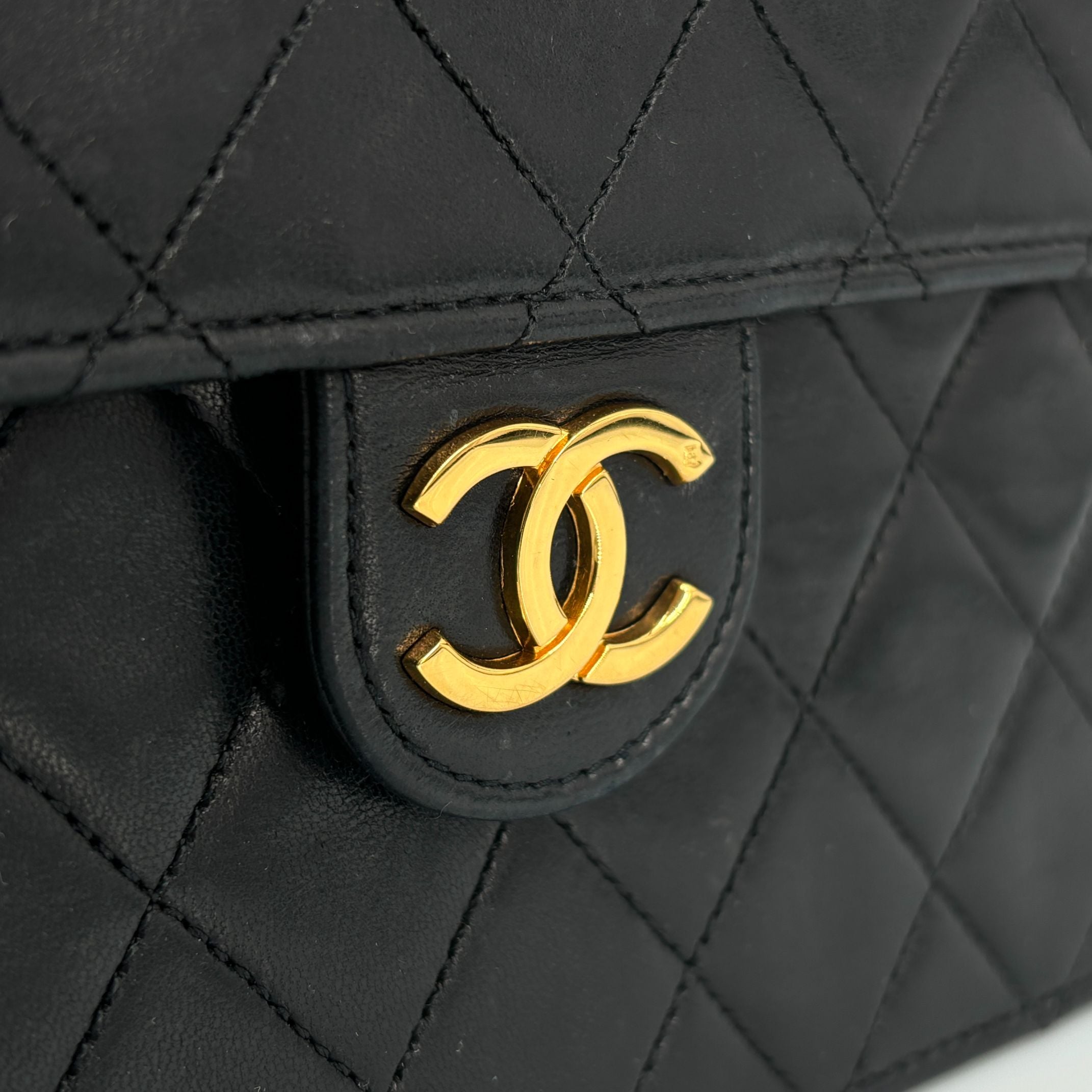 Chanel Single Flap Bag Push-Lock Black Matelassé Leather