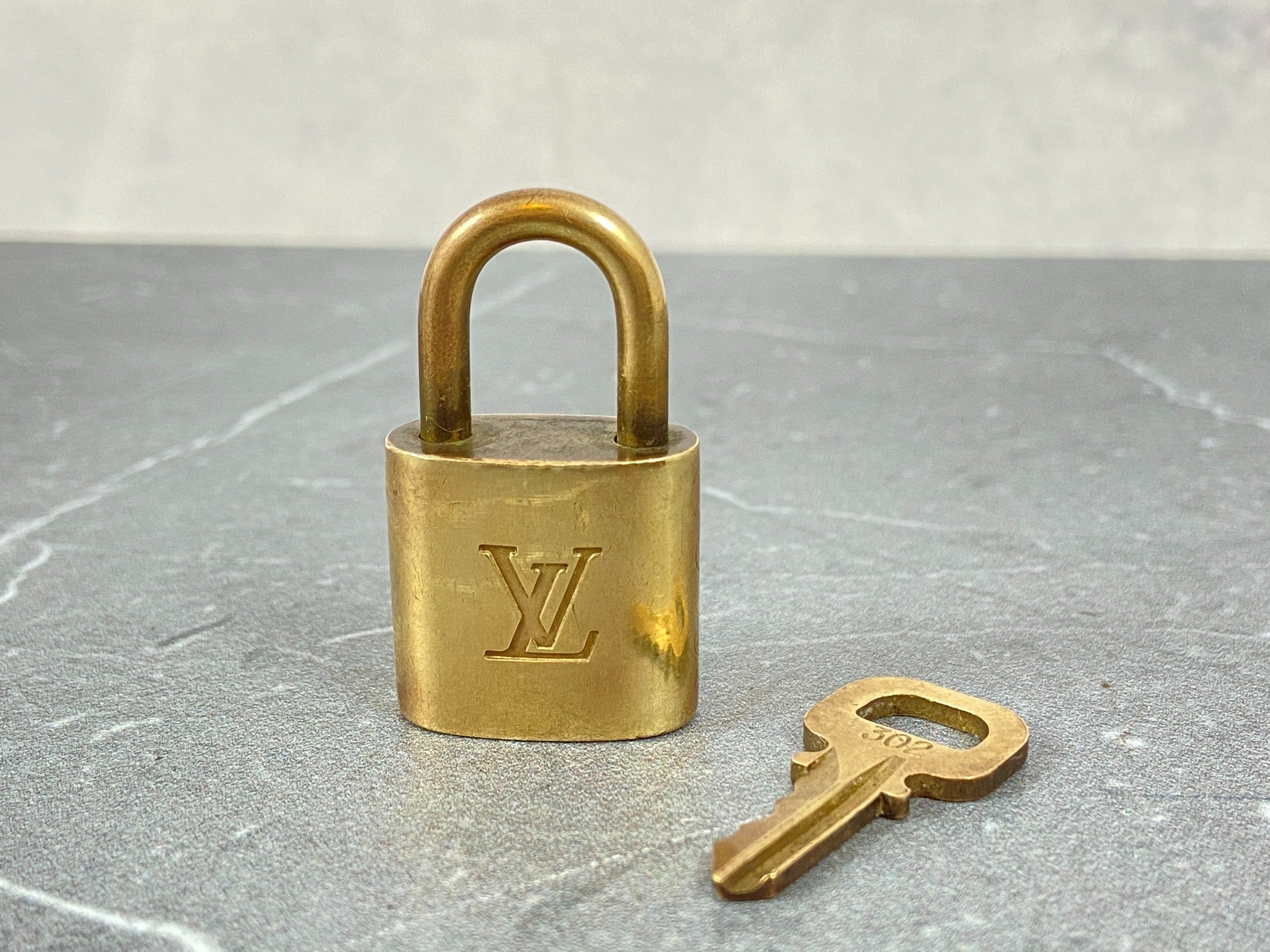 Louis Vuitton 2 Locks & 1 Key Gold Tone No. 302