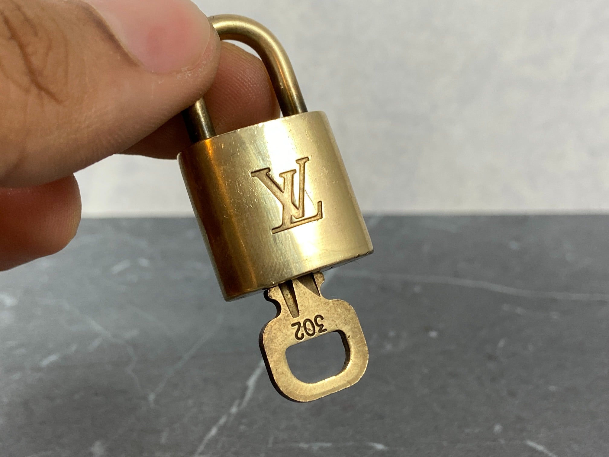 Louis Vuitton 2 Locks & 1 Key Gold Tone No. 302