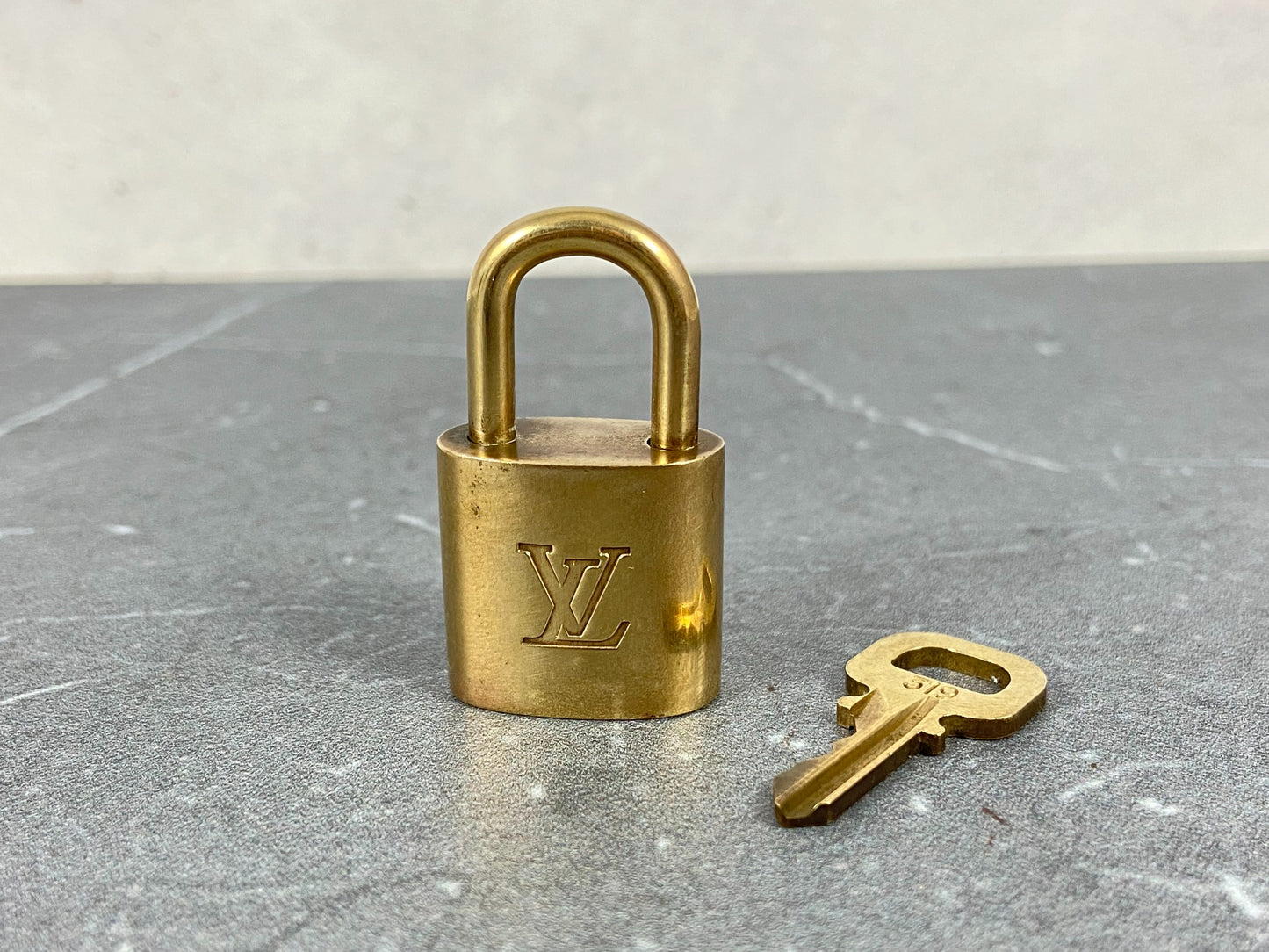 Louis Vuitton Lock Gold Tone No. 319