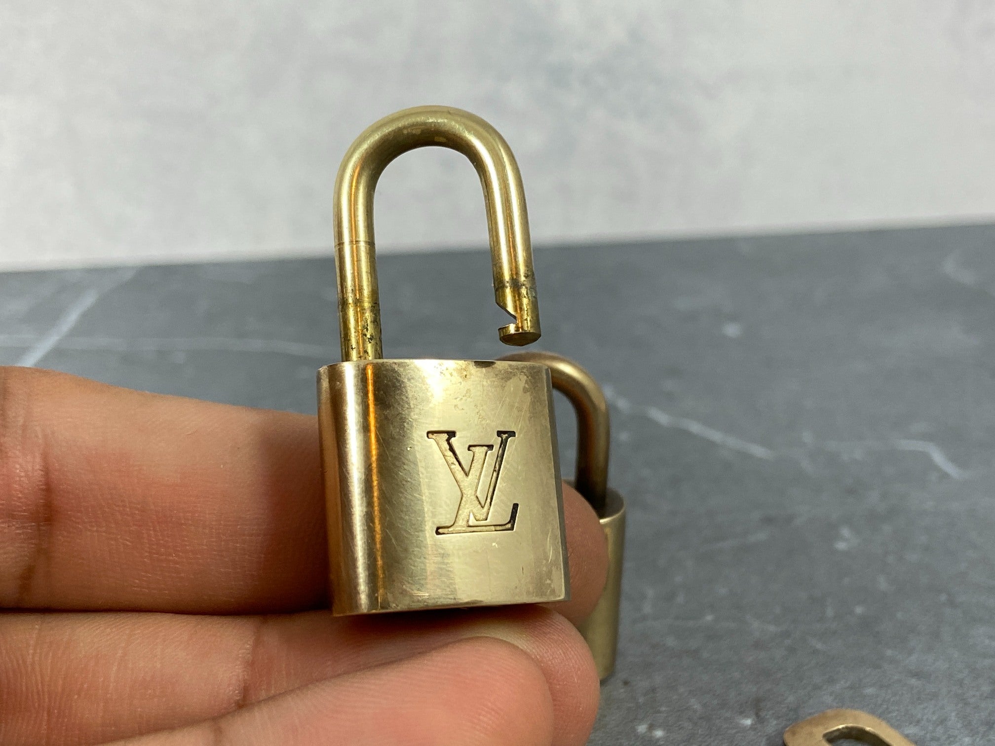 Louis Vuitton 2 Locks & 1 Key Gold Tone No. 302