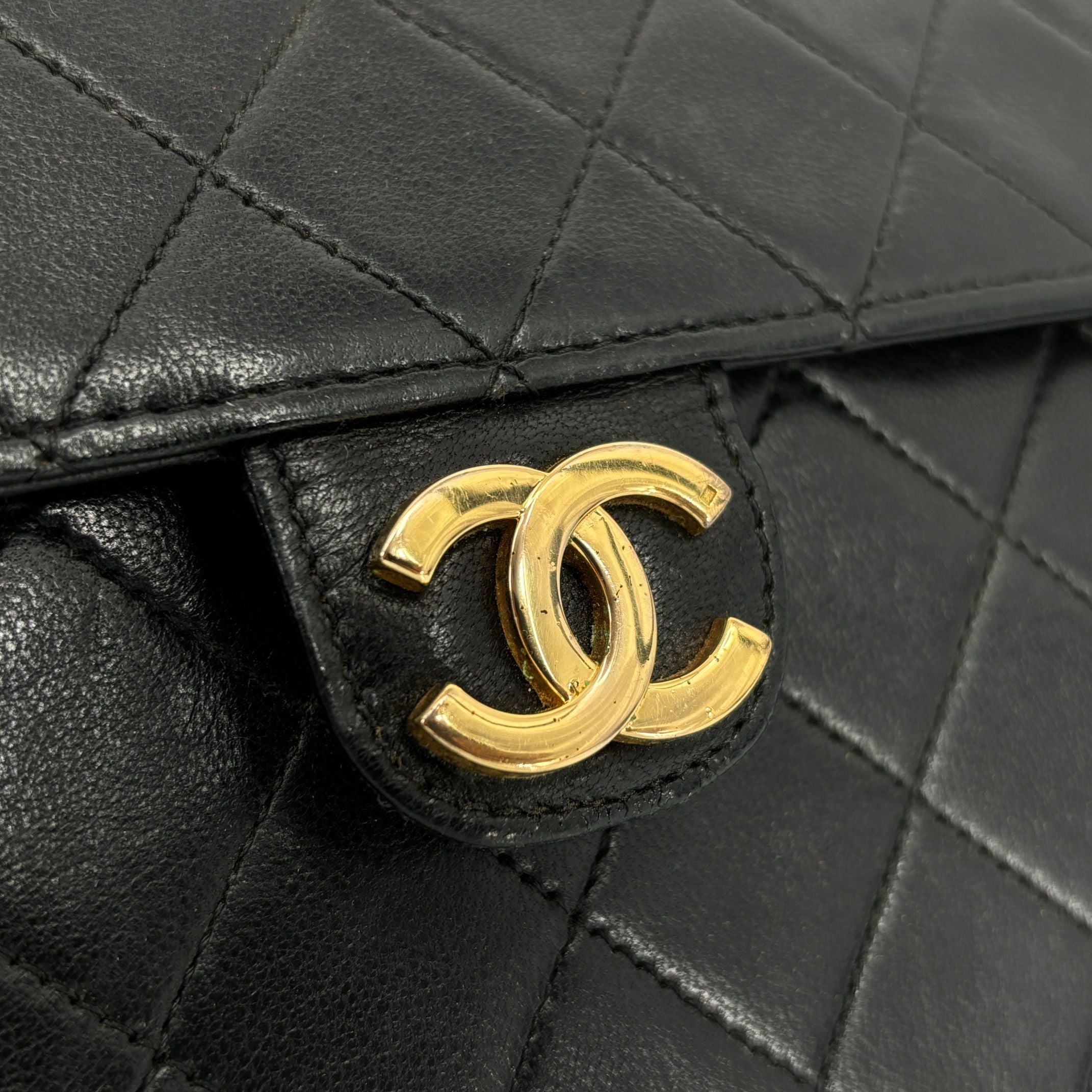 Chanel Single Flap Bag Push-Lock Black Matelassé Leather