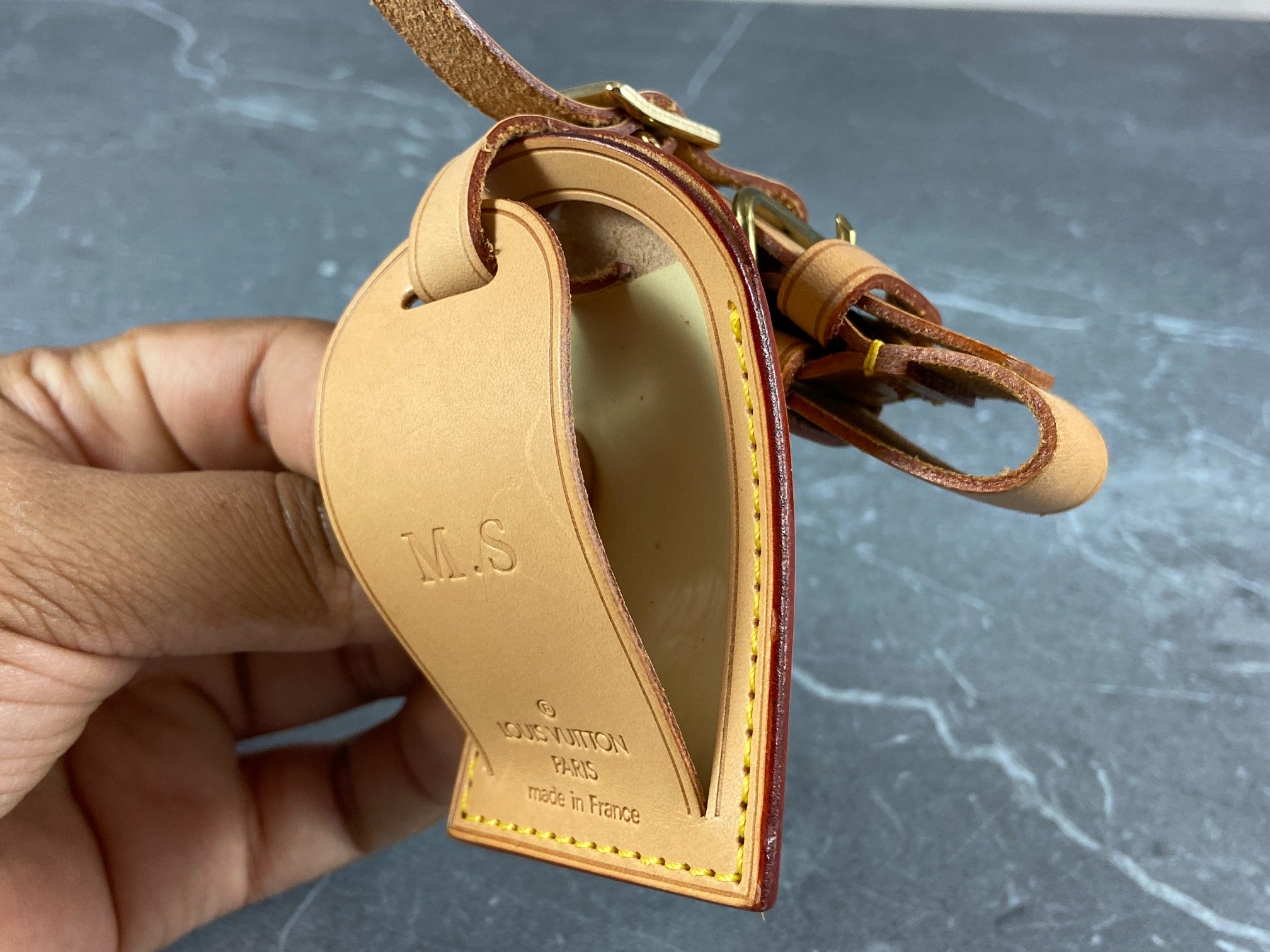 Louis Vuitton vachetta luggage tag offers beige