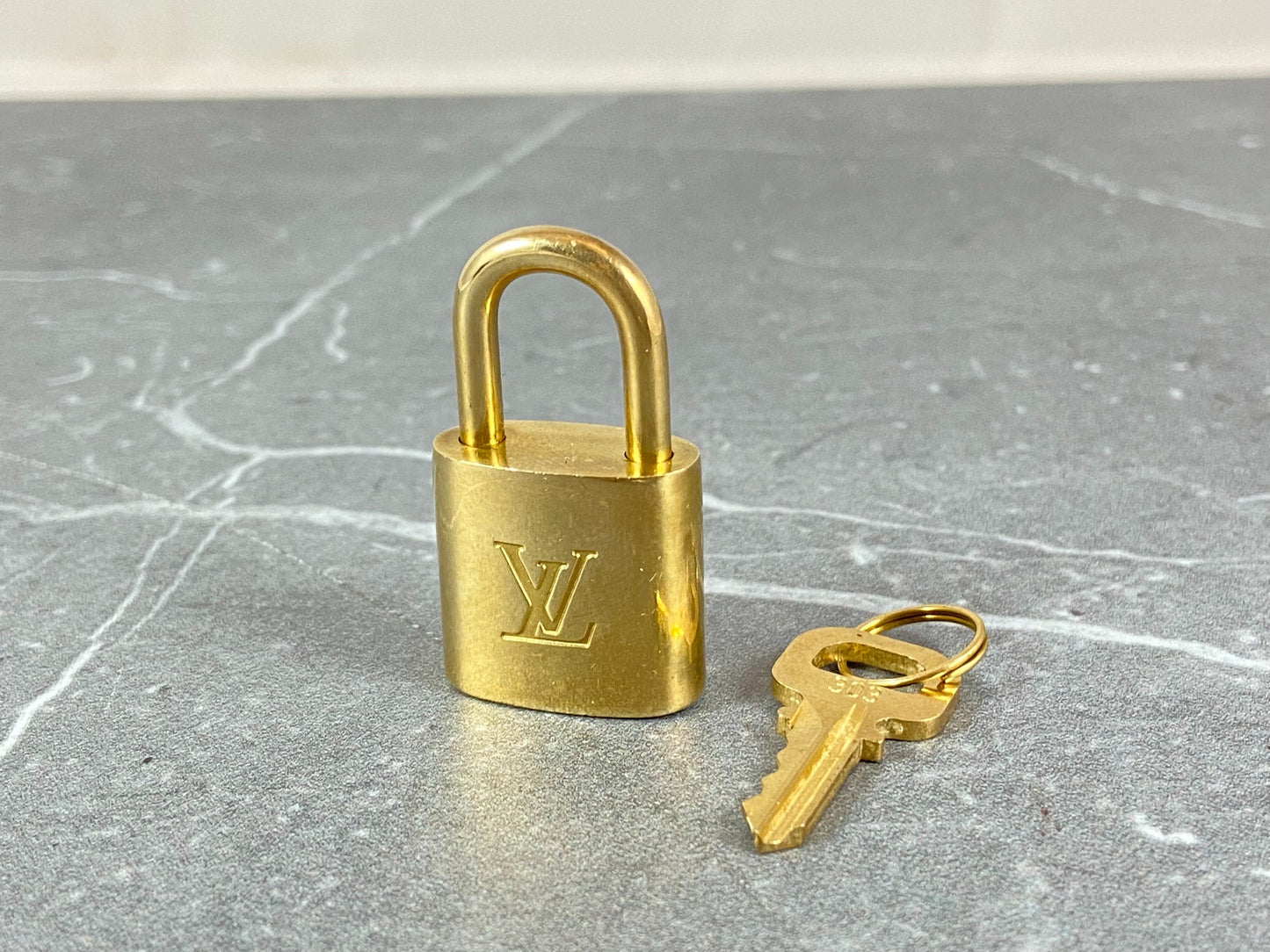 Louis Vuitton Lock Gold Tone No. 303