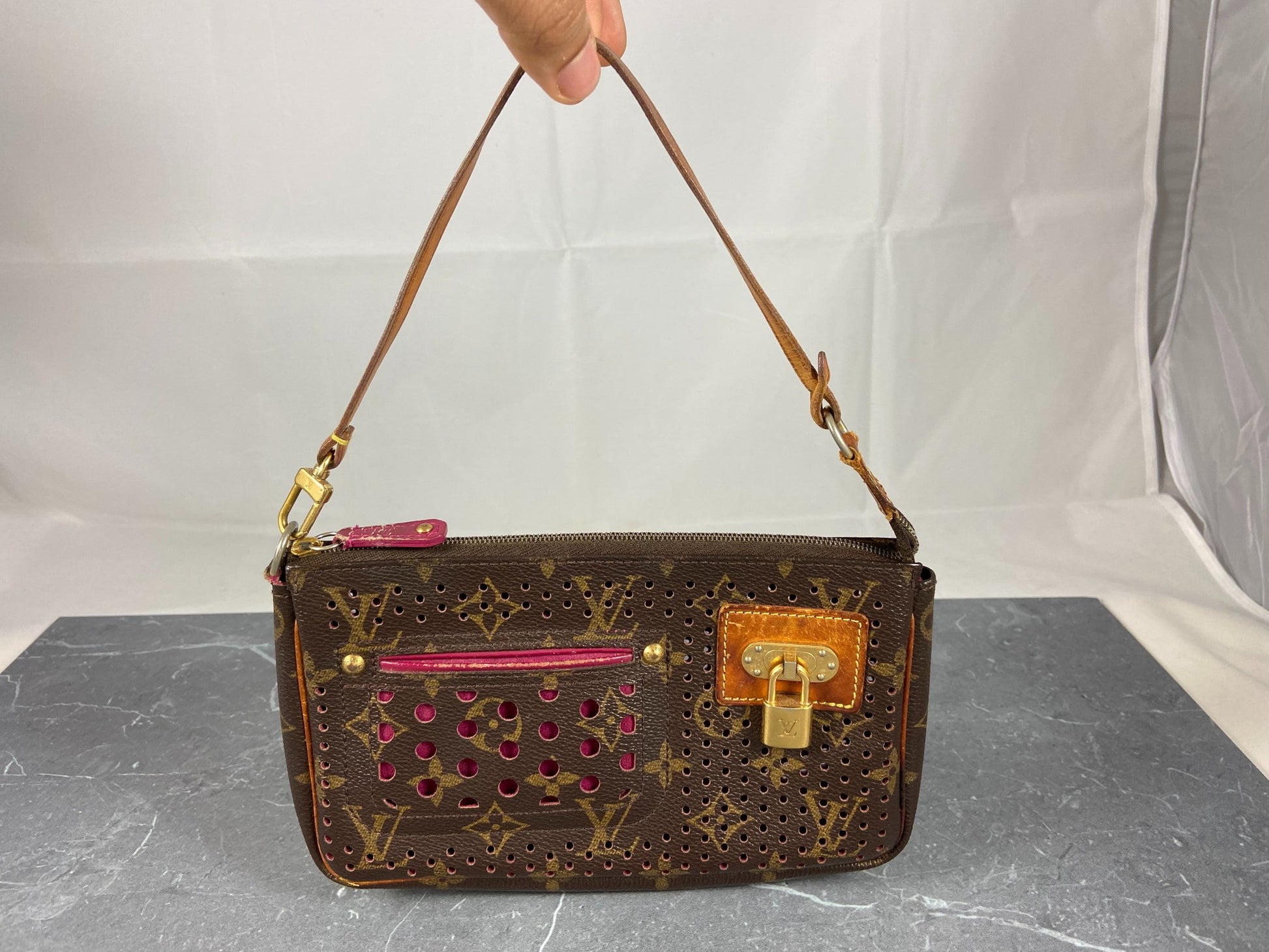 LOUIS VUITTON Monogram Perforated Pochette Accessories Bag Fuchsia 190207